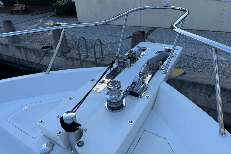Slide: The Image of 2003 Altima 55 Pilothouse boat deck with railing and winch system. - 5