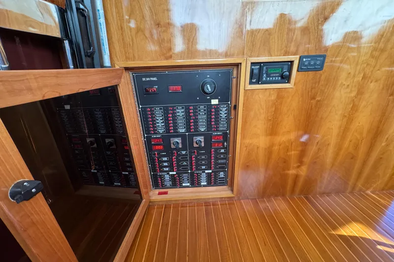 Slide: The Image of Electrical panel in 2003 Altima 55 Pilothouse boat with wooden interior. - 53