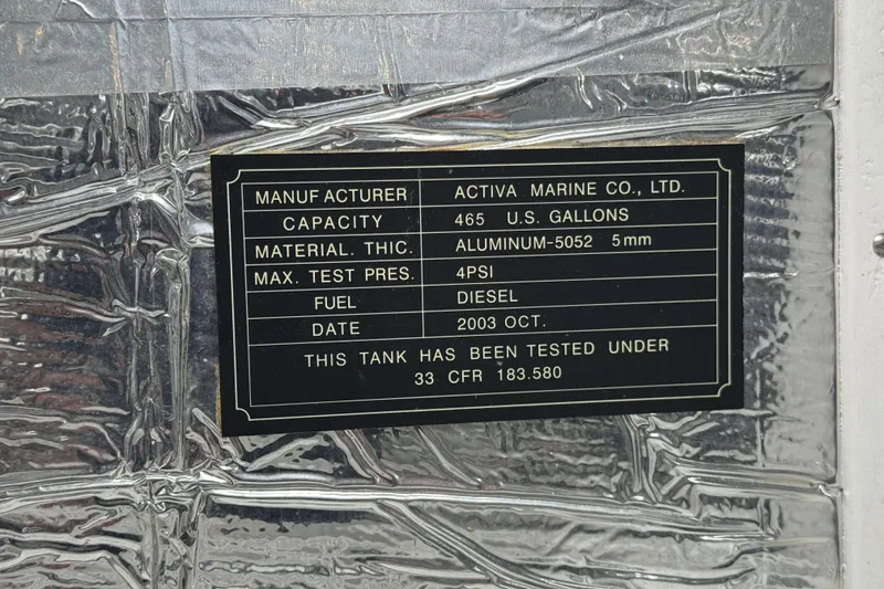 Slide: The Image of 2003 Altima 55 Pilothouse fuel tank label, 465 gallons, aluminum, diesel, tested under 33 CFR 183.580. - 58