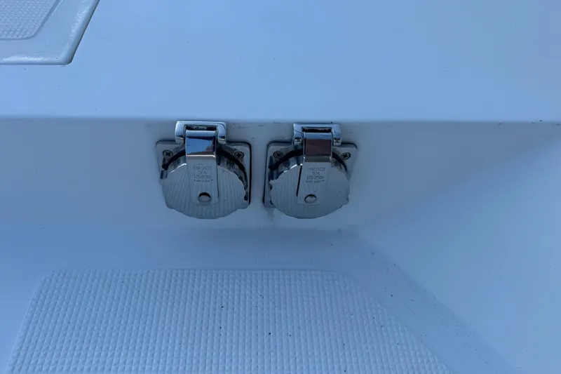 Slide: The Image of 2003 Altima 55 Pilothouse boat deck with two chrome marine power outlets. - 6