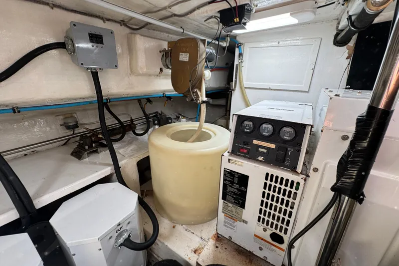 Slide: The Image of Engine room of 2003 Altima 55 Pilothouse with control panel and equipment. - 65