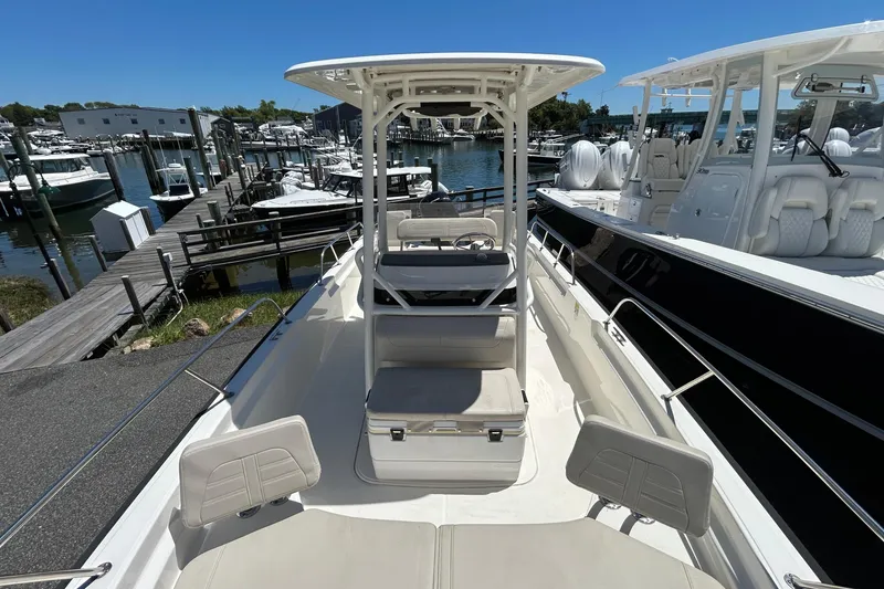 Slide: The Image of 2021 Boston Whaler 210 Montauk boat docked on a sunny day. - 18