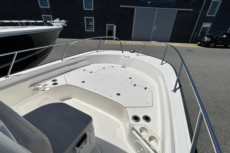 Slide: The Image of 2021 Boston Whaler 210 Montauk boat interior with seating and storage compartments. - 21