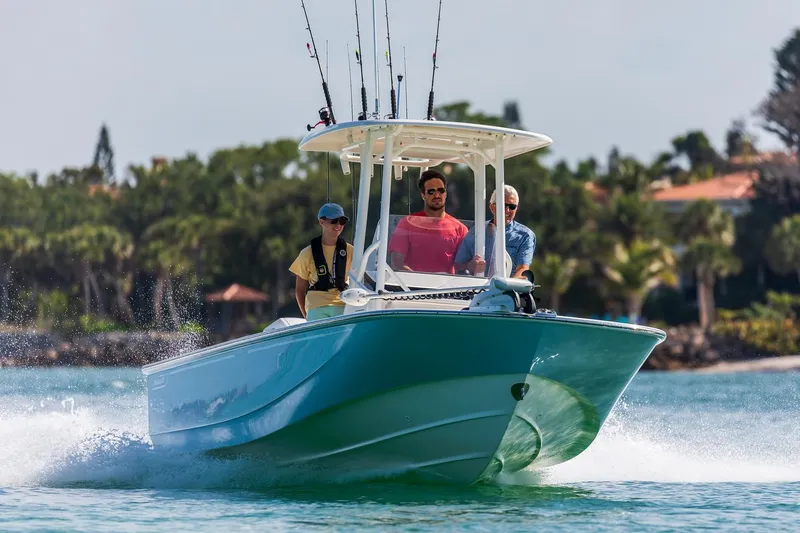 Slide: The Image of Manufacturer Provided Image: 2021 Boston Whaler 210 Montauk boat cruising with three people onboard. - 28