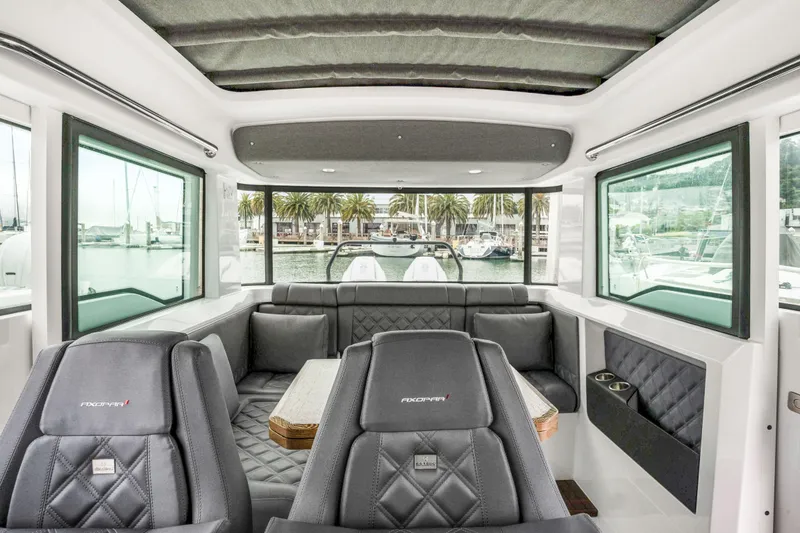 Slide: The Image of Interior of 2021 Axopar 37 XC Cross Cabin with luxurious seating and panoramic windows. - 13