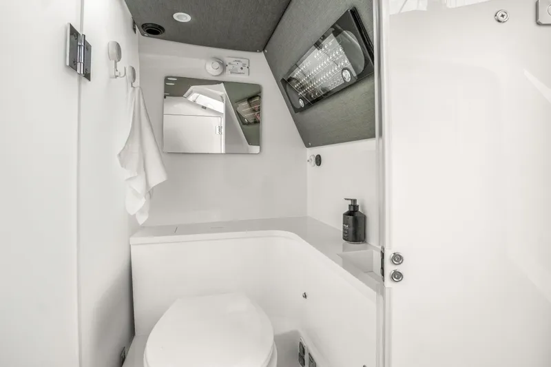 Slide: The Image of 2021 Axopar 37 XC Cross Cabin bathroom with modern fixtures and sleek design. - 26