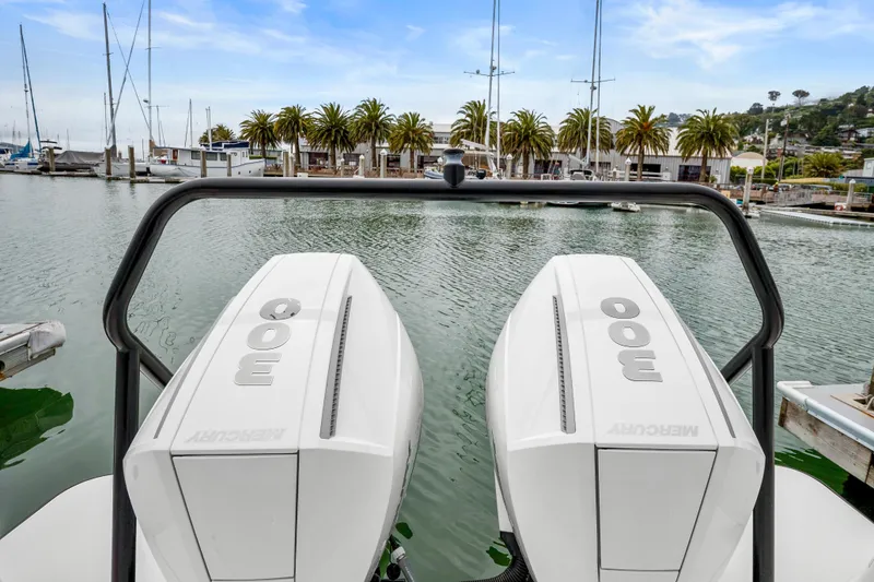 Slide: The Image of 2021 Axopar 37 XC Cross Cabin with twin Mercury 300 engines docked at marina. - 28