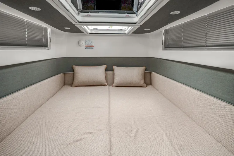 Slide: The Image of Interior cabin of 2021 Axopar 37 XC Cross Cabin with comfortable bedding. - 36