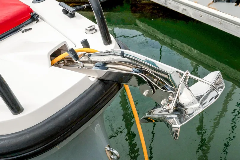 Slide: The Image of 2021 Axopar 37 XC Cross Cabin anchor detail with chrome finish at dock. - 38