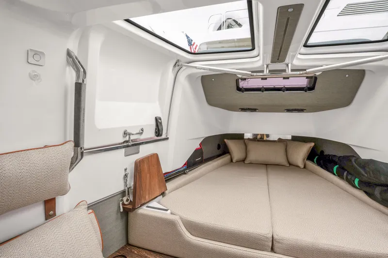 Slide: The Image of Interior cabin of 2021 Axopar 37 XC Cross Cabin with cozy bedding and modern design. - 39