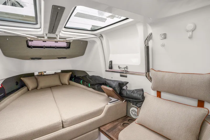 Slide: The Image of Interior cabin of 2021 Axopar 37 XC Cross Cabin with cozy seating and cushions. - 40