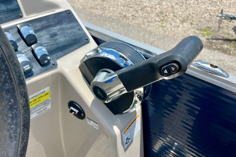 Slide: The Image of Throttle control of 2023 Harris Cruiser 230 boat, featuring modern dashboard design. - 15