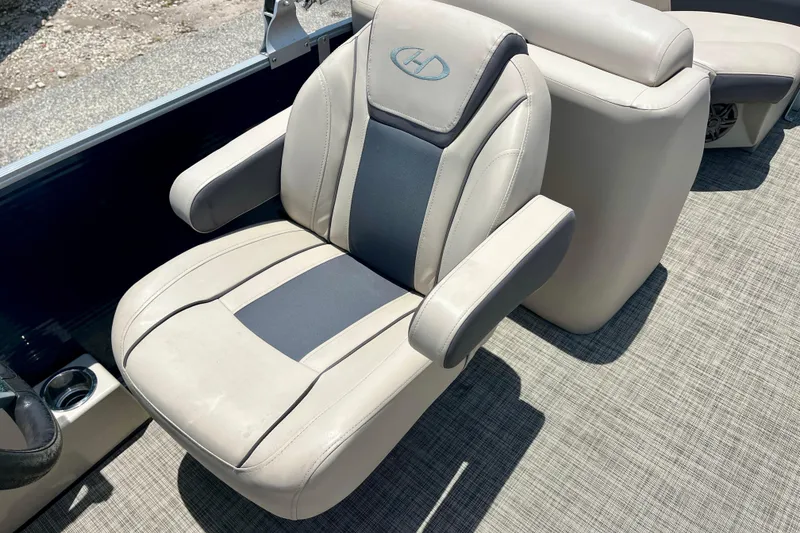 Slide: The Image of 2023 Harris Cruiser 230 boat seat with armrests and stylish upholstery. - 16