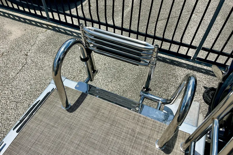 Slide: The Image of Stainless steel ladder on 2023 Harris Cruiser 230 boat deck. - 17