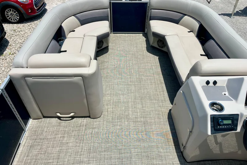 Slide: The Image of 2023 Harris Cruiser 230 pontoon boat interior with plush seating and modern console. - 7