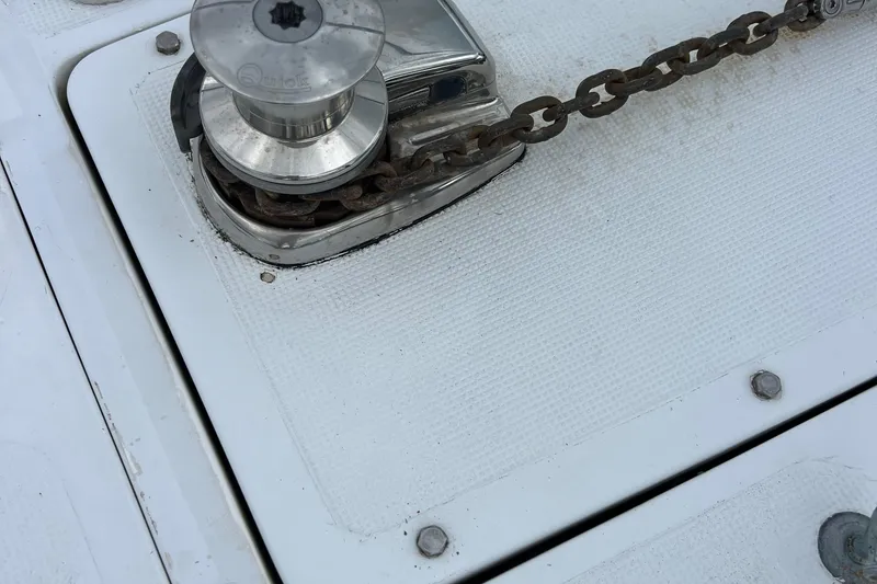 Slide: The Image of Anchor winch and chain on 1998 Hyatt 51 Aft Cabin Motor Yacht deck. - 15