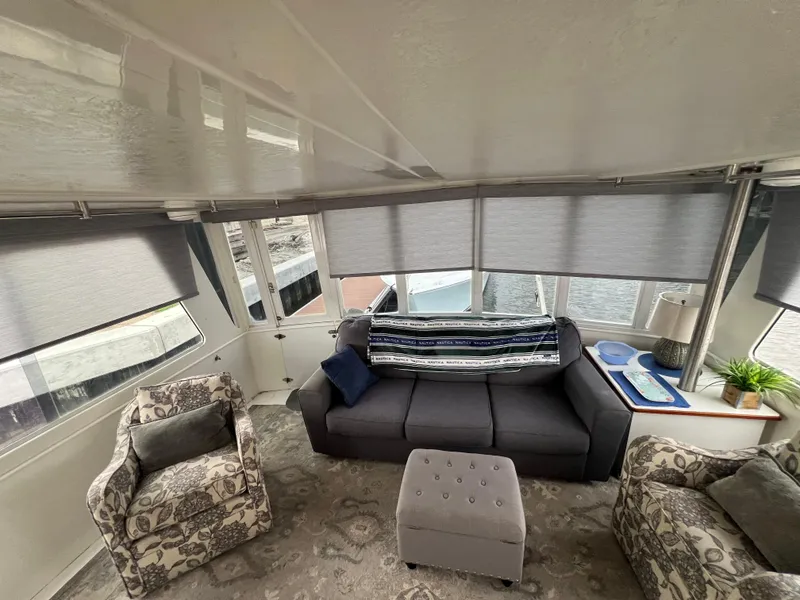 Slide: The Image of Luxurious interior of 1998 Hyatt 51 Aft Cabin Motor Yacht with cozy seating area. - 26