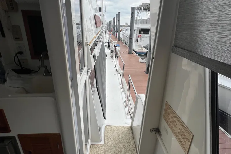 Slide: The Image of 1998 Hyatt 51 Aft Cabin Motor Yacht docked, view from interior to deck. - 30