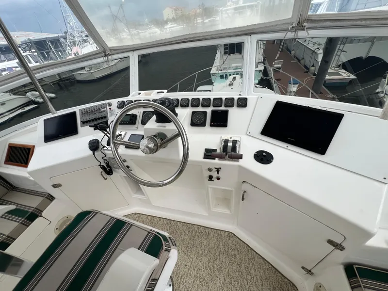 Slide: The Image of Helm of 1998 Hyatt 51 Aft Cabin Motor Yacht with modern navigation equipment. - 42