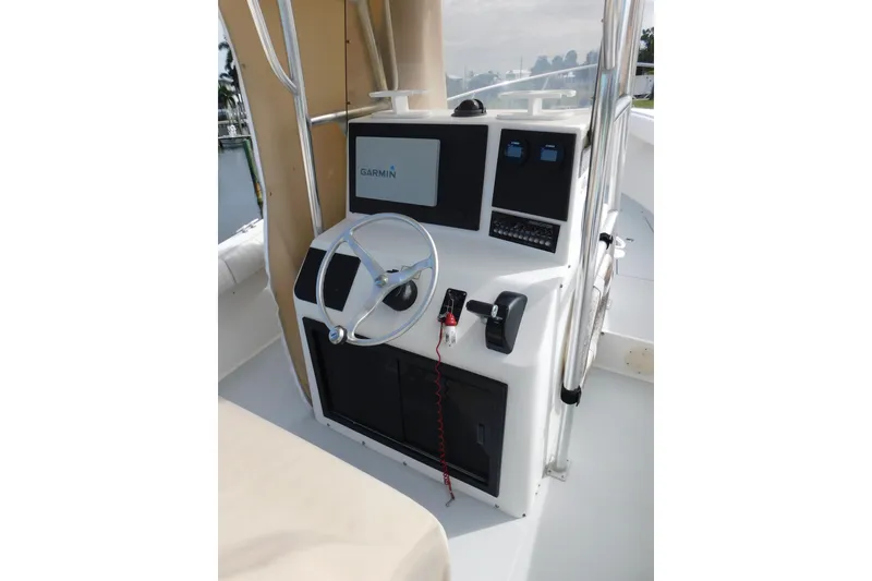 Slide: The Image of 1996 Regulator 23 Center Console boat helm with Garmin navigation system. - 14