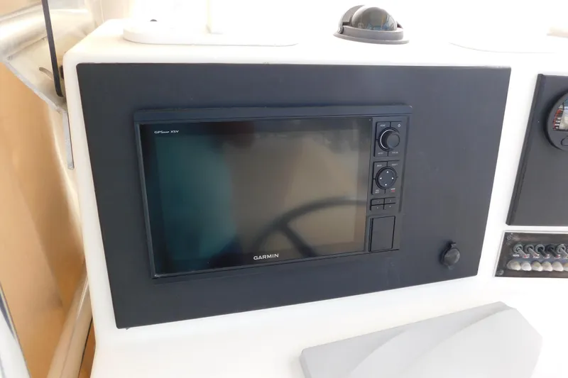 Slide: The Image of Garmin GPS display on 1996 Regulator 23 Center Console boat dashboard. - 15