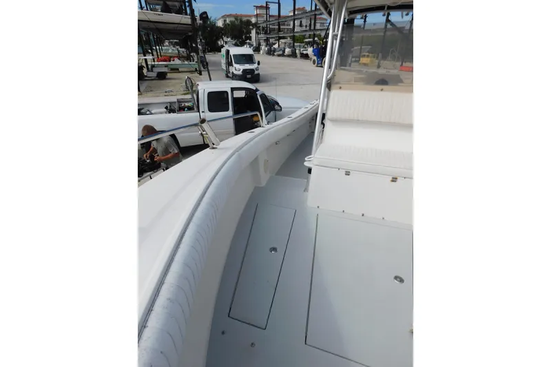Slide: The Image of 1996 Regulator 23 Center Console boat interior with seating and storage compartments. - 26