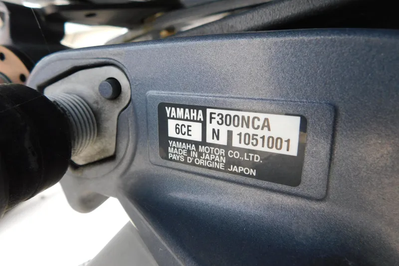 Slide: The Image of Close-up of Yamaha F300NCA engine label on a 1996 Regulator 23 Center Console. - 32