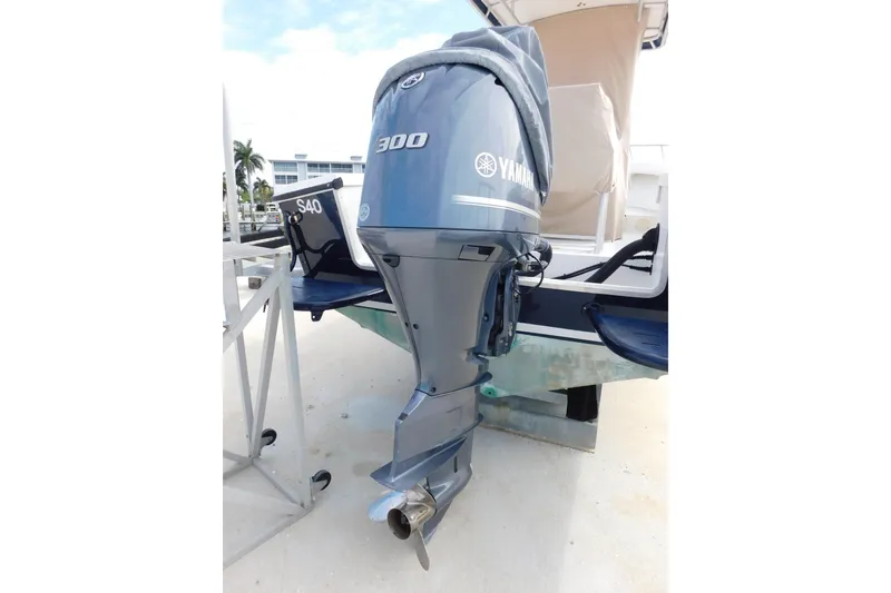 Slide: The Image of 1996 Regulator 23 Center Console with Yamaha 300 outboard motor, docked outdoors. - 7