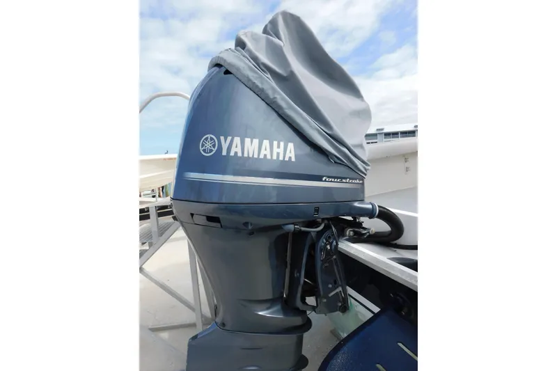 Slide: The Image of Yamaha four-stroke outboard motor on 1996 Regulator 23 Center Console boat. - 8