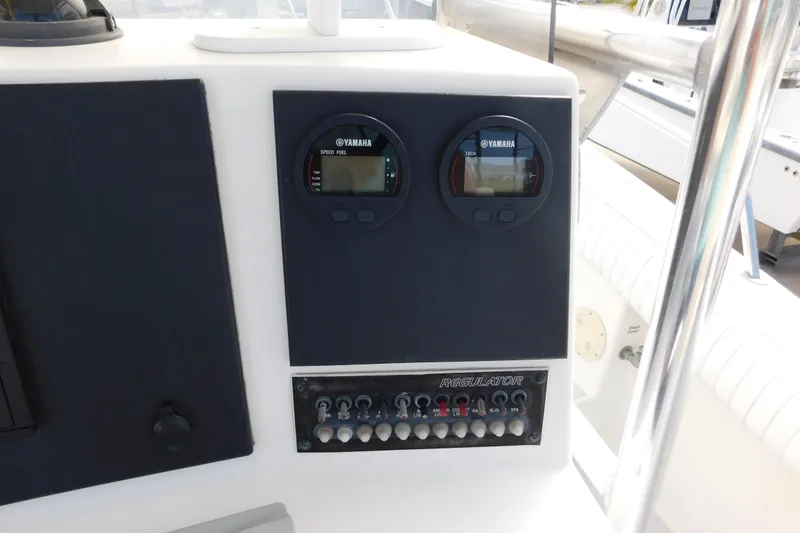 Slide: The Image of 1996 Regulator 23 Center Console dashboard with Yamaha gauges and control panel. - 17