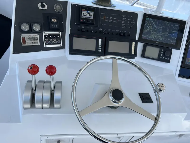 Slide: The Image of 1991 Viking Convertible boat helm with navigation instruments. - 31