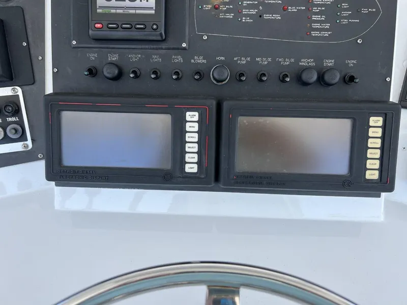 Slide: The Image of Dashboard of a 1991 Viking Convertible boat with navigation systems. - 33