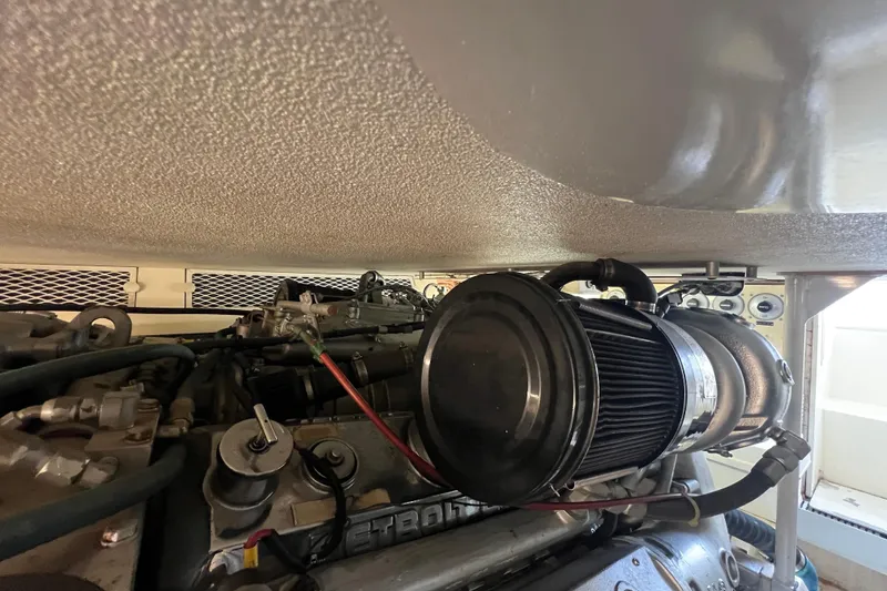 Slide: The Image of Engine compartment of a 1991 Viking Convertible boat, showcasing mechanical components. - 79