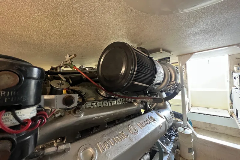 Slide: The Image of Engine room of a 1991 Viking Convertible boat with Detroit Diesel engine. - 89