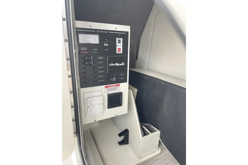 Slide: The Image of Control panel of 2023 Sea Ray 290 Amberjack boat, featuring electrical switches and gauges. - 15