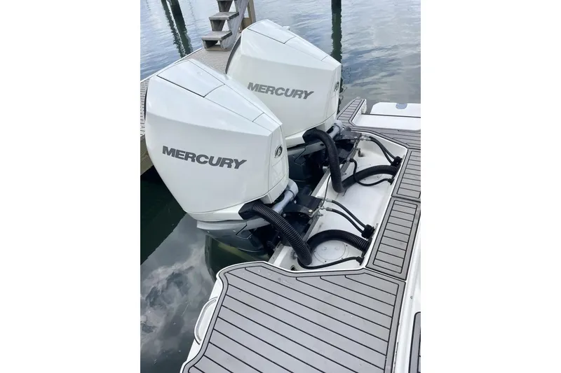 Slide: The Image of Twin Mercury outboard engines on a 2023 Sea Ray 290 Amberjack boat. - 6