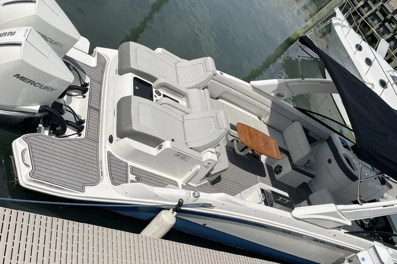 Slide: The Image of 2023 Sea Ray 290 Amberjack boat with spacious seating and twin Mercury engines. - 8