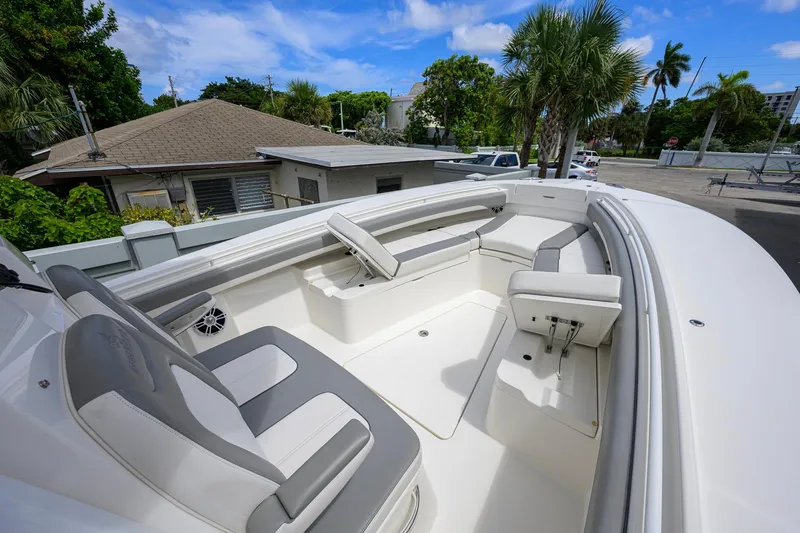 Slide: The Image of 2023 Regulator 28 boat interior with cushioned seating and sleek design. - 20