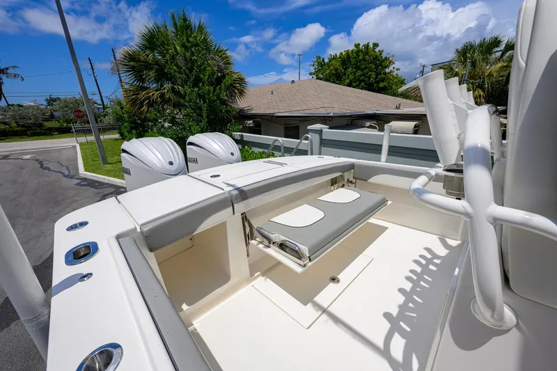 Slide: The Image of 2023 Regulator 28 boat with Yamaha engines, featuring a sleek deck and seating area. - 30