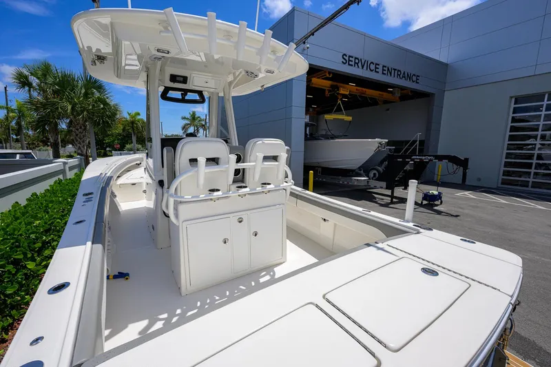Slide: The Image of 2023 Regulator 28 boat at service entrance, showcasing sleek design and spacious deck. - 39
