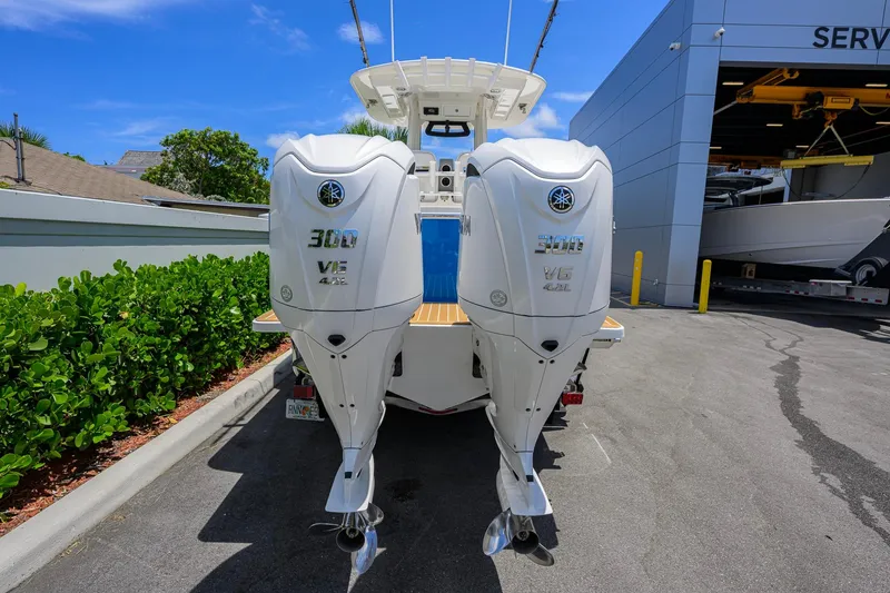 Slide: The Image of 2023 Regulator 28 boat with twin Yamaha 300 V6 outboard engines at a service center. - 46