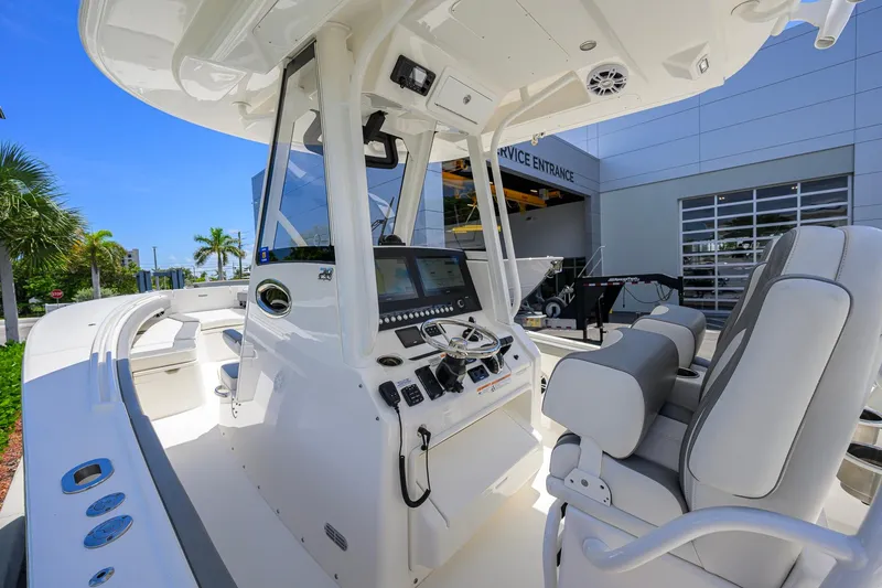 Slide: The Image of 2023 Regulator 28 boat interior with modern helm and seating, showcasing luxury design. - 8