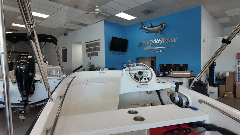 Slide: The Image of The image shows the cockpit of a 2027 Boston Whaler 130 Super Sport in a showroom. - 5