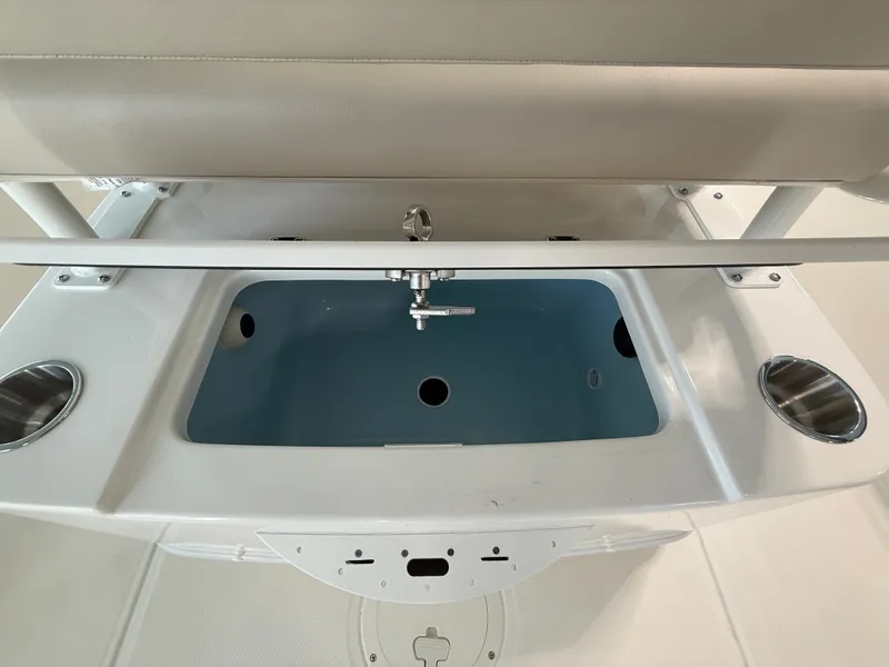 Slide: The Image of The image shows the cockpit of a 2027 Boston Whaler 210 Montauk with a built-in sink. - 23