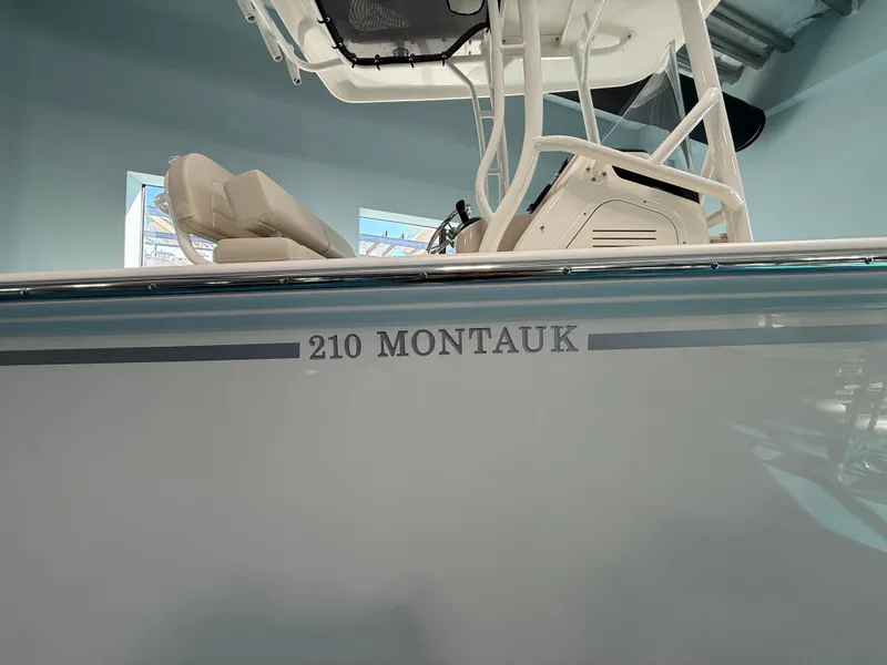 Slide: The Image of Boston Whaler 210 Montauk from 2027 in a showroom. - 2