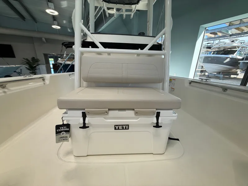 Slide: The Image of The 2027 Boston Whaler 210 Montauk features a bench seat with an integrated Yeti cooler. - 10
