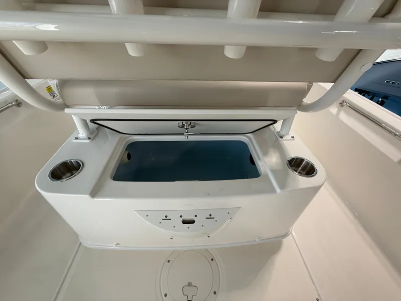 Slide: The Image of The image shows the interior of a 2027 Boston Whaler 210 Montauk with a storage compartment. - 22