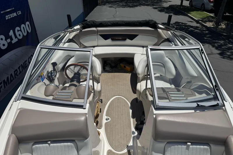 Slide: The Image of 2009 Glastron GLS 215 boat interior with seating and steering wheel. - 20