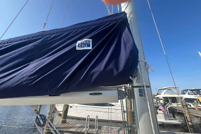 Slide: The Image of Island Packet 44 cutter sailboat with Schurr Sails cover, docked at marina, 1994 model. - 18