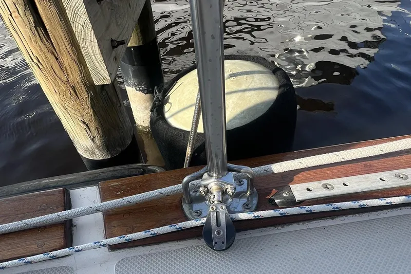 Slide: The Image of Close-up of 1994 Island Packet 44 cutter deck with dock fender and ropes. - 27